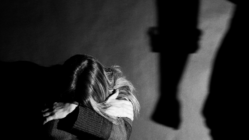 Black and white stock image of a young girl in distress