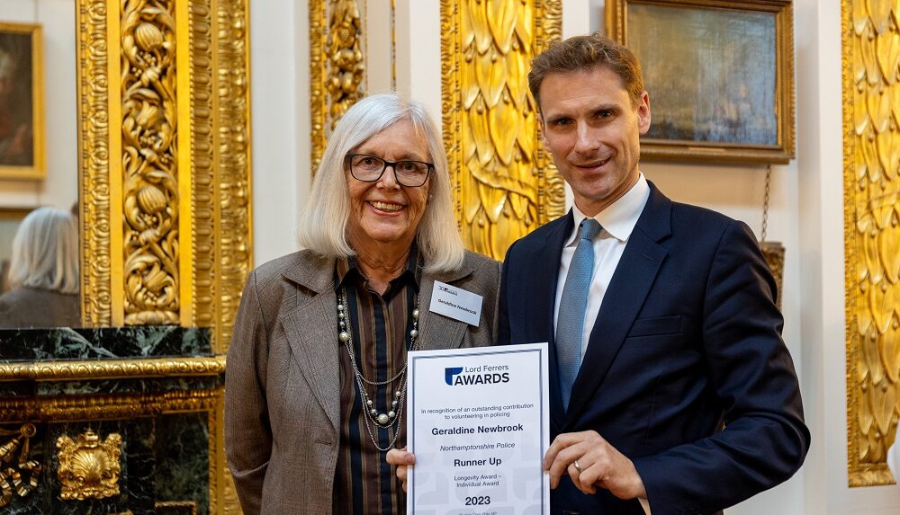 Geraldine Newbrook (left) is pictured with Chris Philp MP (right), who is holding up a certificate acknowledging Geraldine for the many hours of volunteering she has put in over more than 35 years