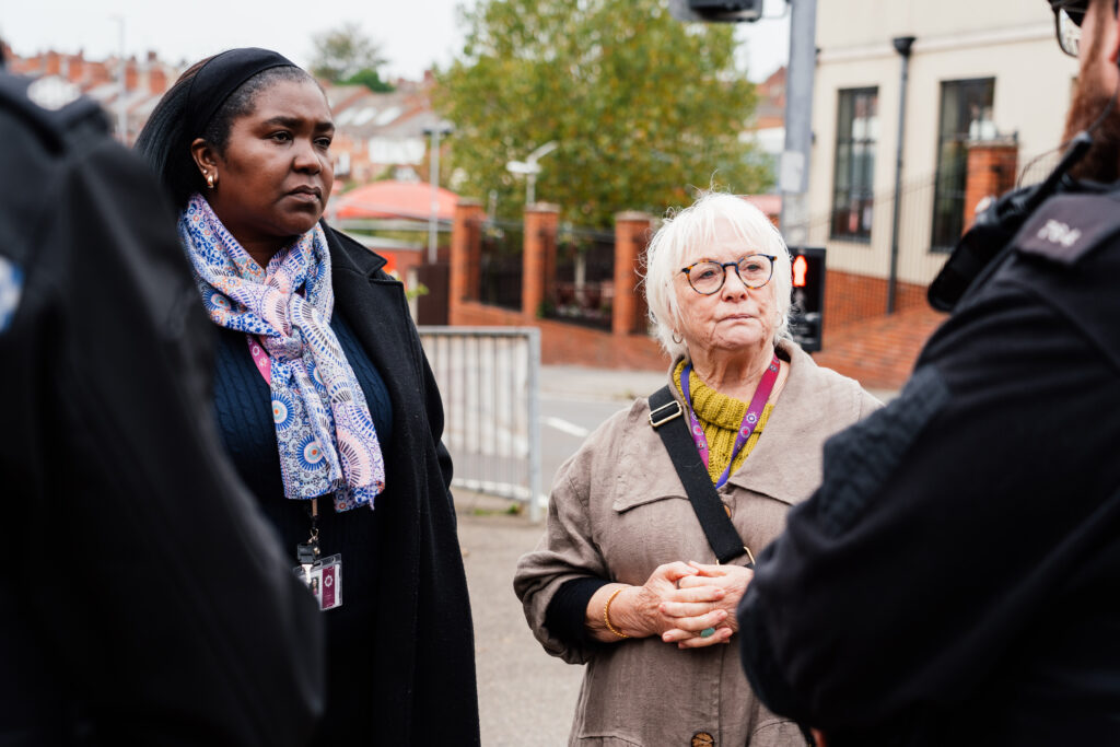 PFCC Danielle Stone stands with Deputy PFCC Marianne Kimani talking to two neighbourhood Police Officers