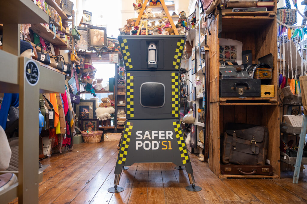 A large blue security camera unit in a shop