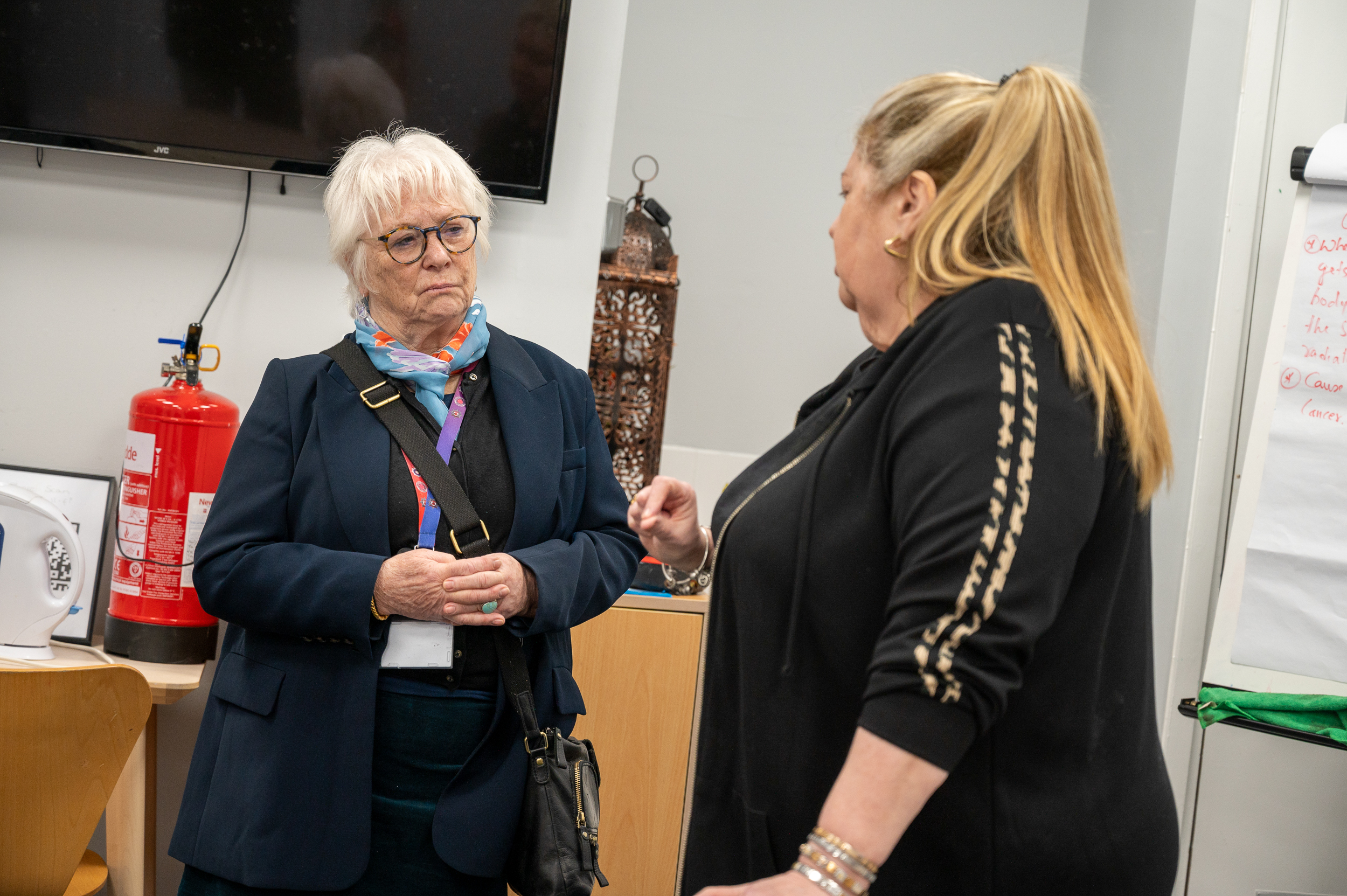 PFCC Danielle Stone wearing a dark blue jacket and trousers speaks to Centre Manager Lynn Johnston, wearing all black