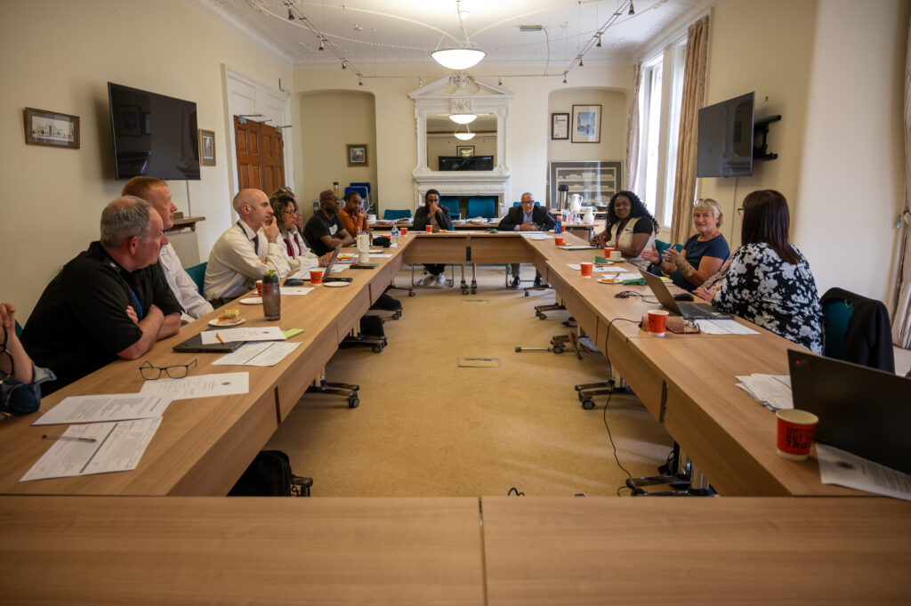 A meeting room full during a meeting