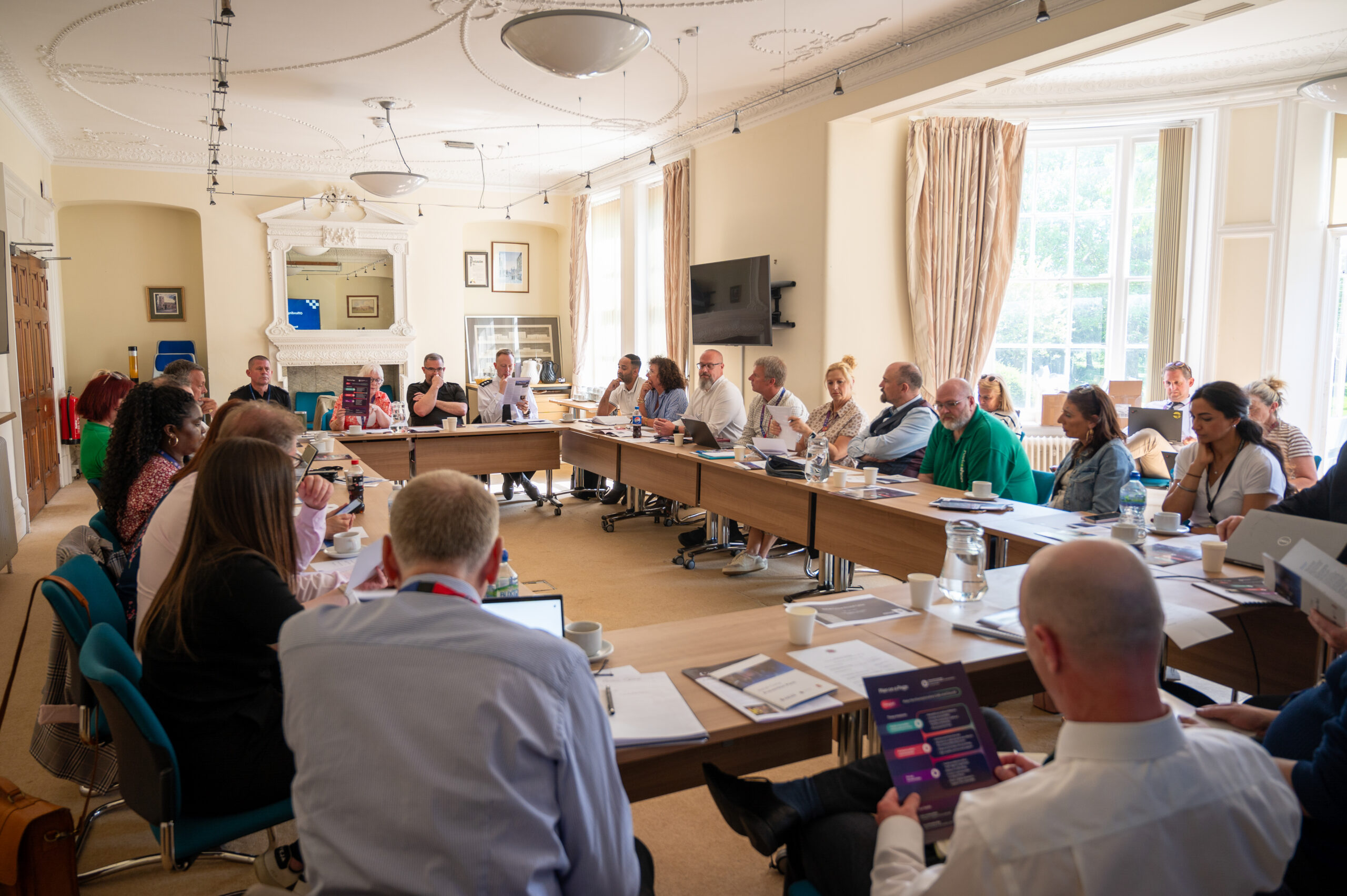 Retail crime roundtable members including retailers and crime prevention specialists gathered at Wootton Hall alongside the Commissioner and Chief Constable.