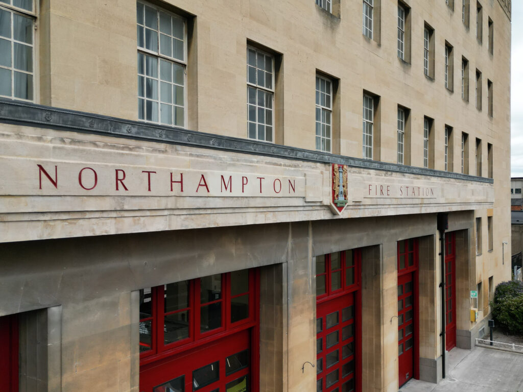 Engraved lettering above Northampton Fire Station doors has been freshly painted to replicate how the building used to look.
